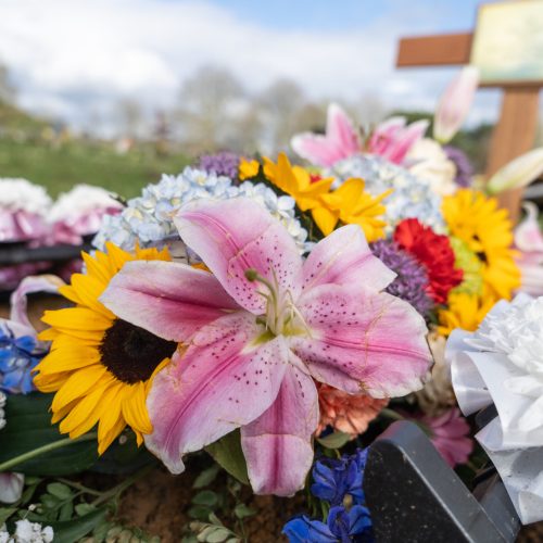 flowers on a grave at funeral